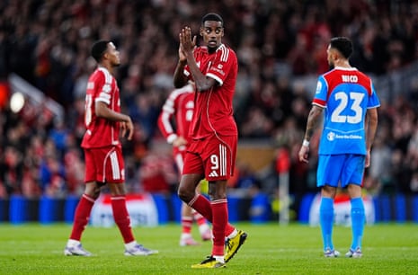 Liverpool's Alexander Isak (centre) applauds the fans as he is substituted .