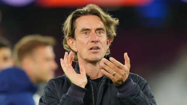 Thomas Frank applauds Tottenham fans after his side's win at West Ham in September 2025