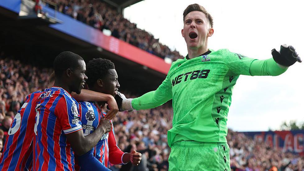 Crystal Palace goalkeeper Dean Henderson joins the celebrations after Eddie Nketiah's winner