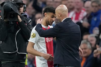 Ajax's Noussair Mazraoui is hugged by Ajax's then head coach Erik ten Hag in 2022. AP