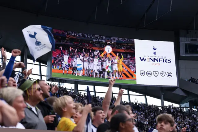 Tottenham fans celebrate at home following their Europa League win