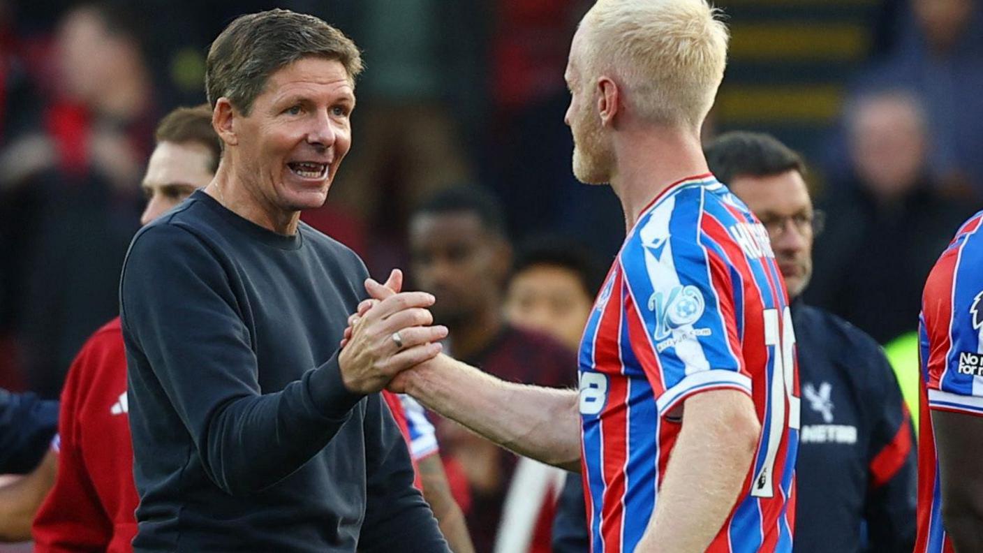 Crystal Palace manager Oliver Glasner congratulates Will Hughes after the win against Liverpool