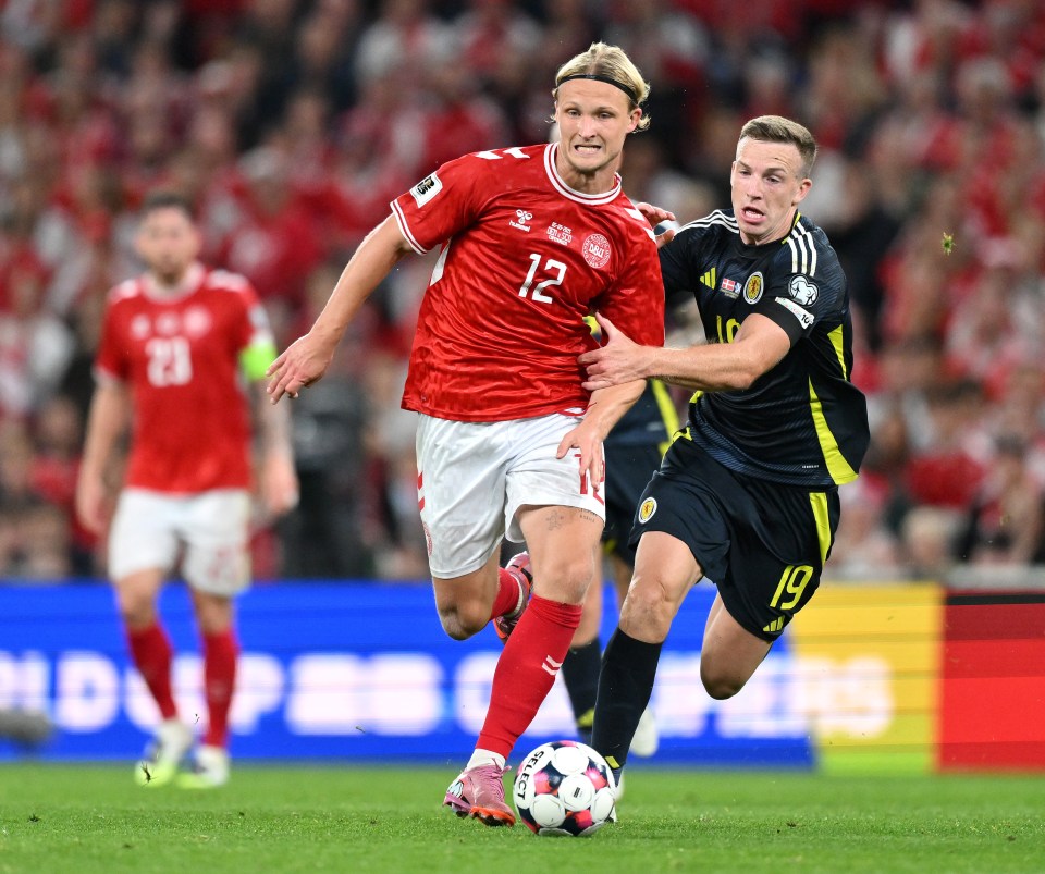 Kasper Dolberg of Denmark dribbling the ball during a soccer match.