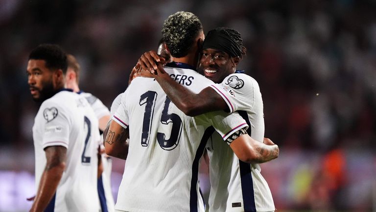 England's Noni Madueke celebrates scoring his sides second goal with Morgan Rogers during the 2026 FIFA World Cup Qualifying, Group K match